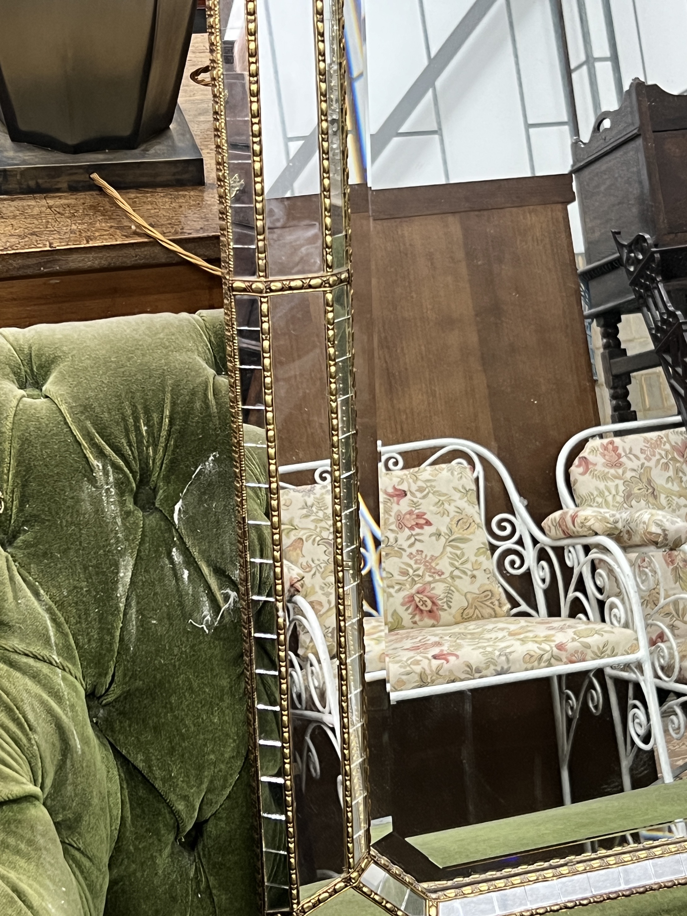 A Venetian style octagonal gilt metal mounted wall mirror, width 106cm, height 75cm